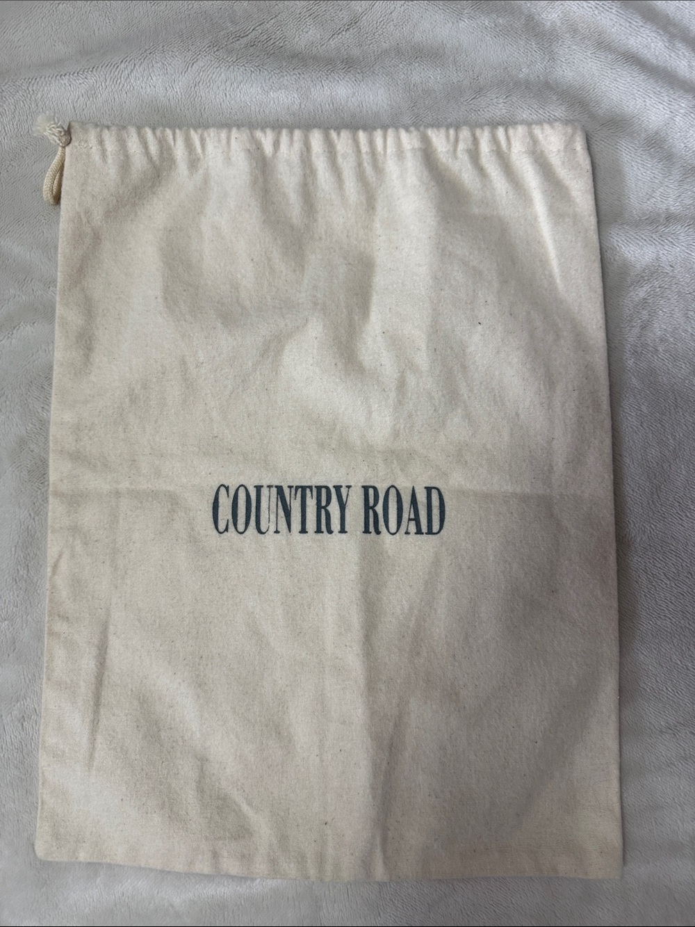 An authentic cotton dust bag by Country Road